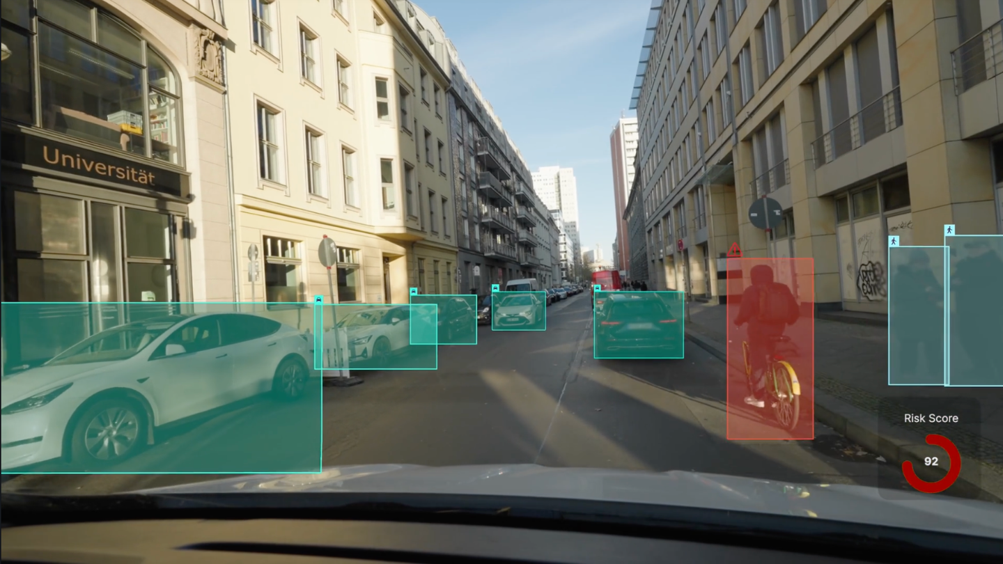 The captured frame with the cyclist, vehicles and road assets detected