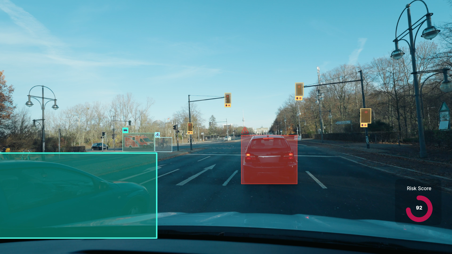 A road scene with a tailgating and distraction event detected and scored on the device